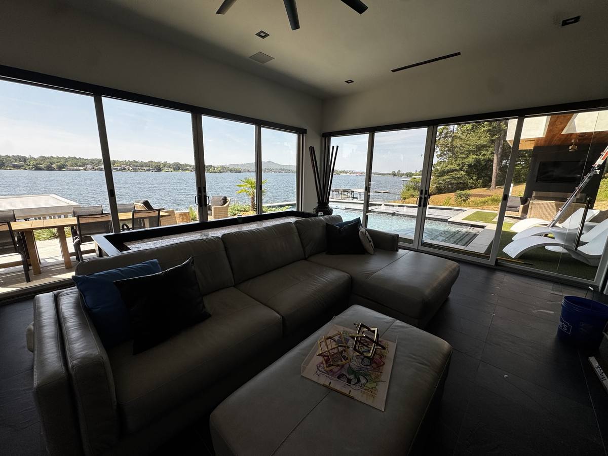 Floor-to-ceiling sliding glass doors cleaned, lake view living room