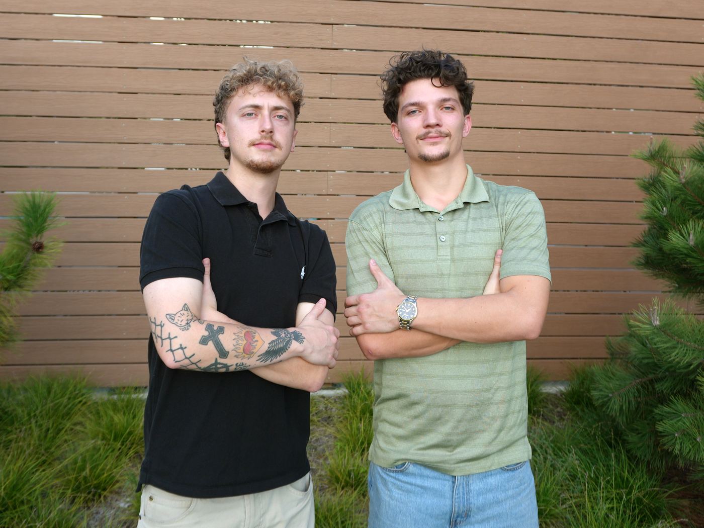 Christian Puckett, owner of Puckett's Window Cleaning in Dallas–Fort Worth, with a crew member